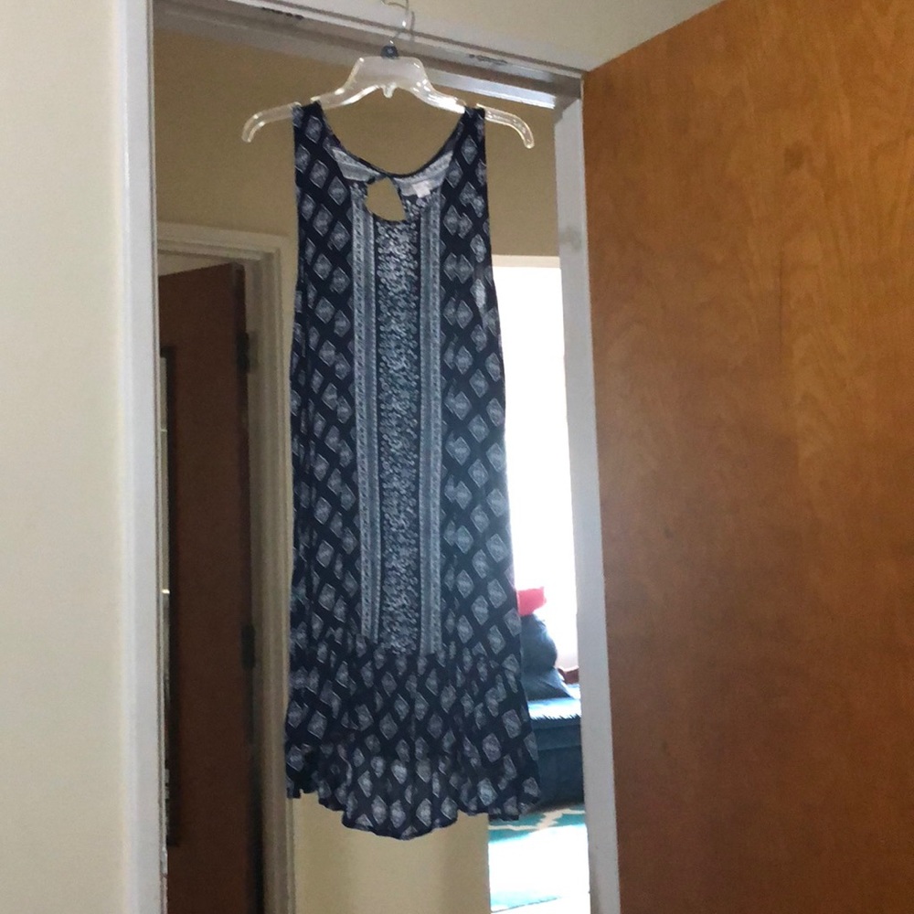 Mid length blue dress.